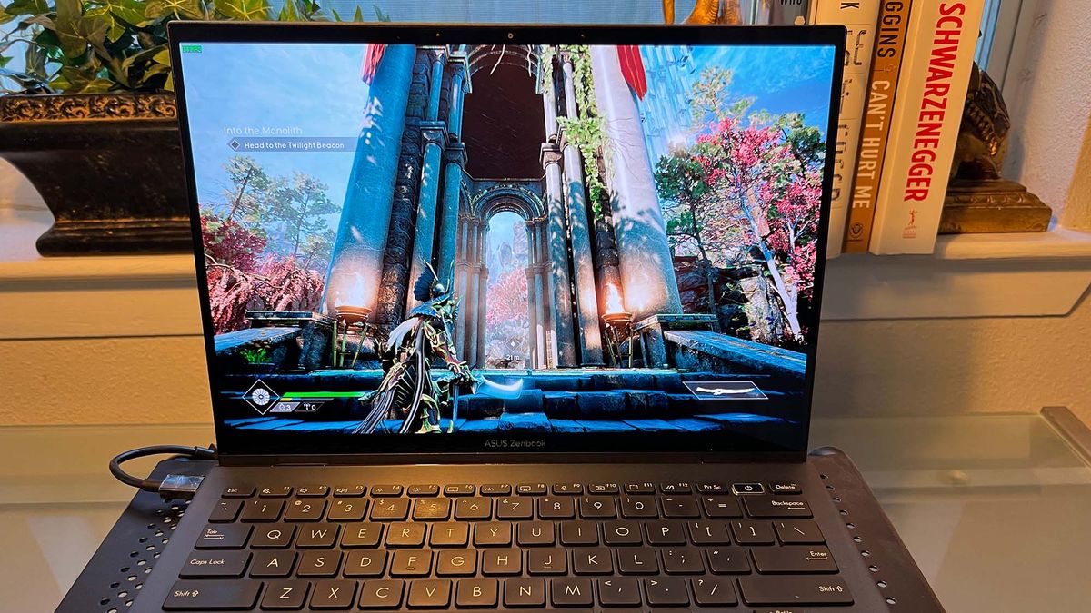 An Asus Zenbook S 13 OLED on a laptop stand