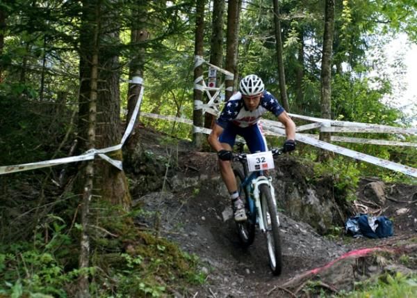 Kerry Warner, one of the US juniors racing in Champery in June, rides off one of the many small technical pieces on the Champery course