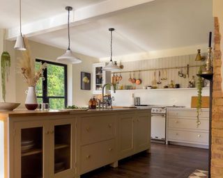 Neutral kitchen with pendant lighting and island