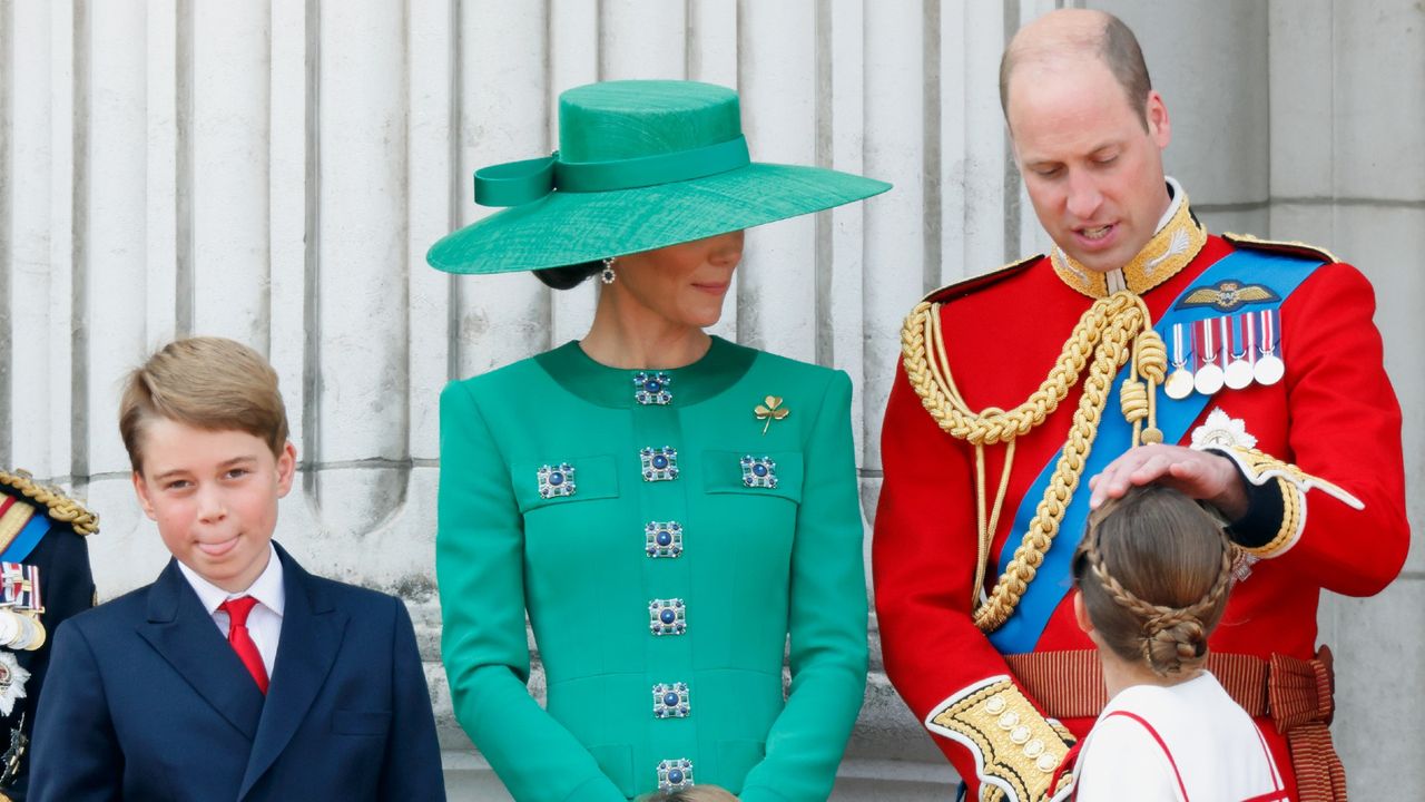 Princess Charlotte looks up at her father, Prince William