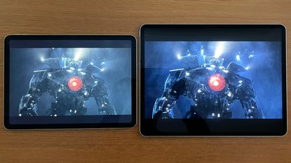 iPad Pro 12.9-inch next to iPad Air 2020, both showing the same still from a movie