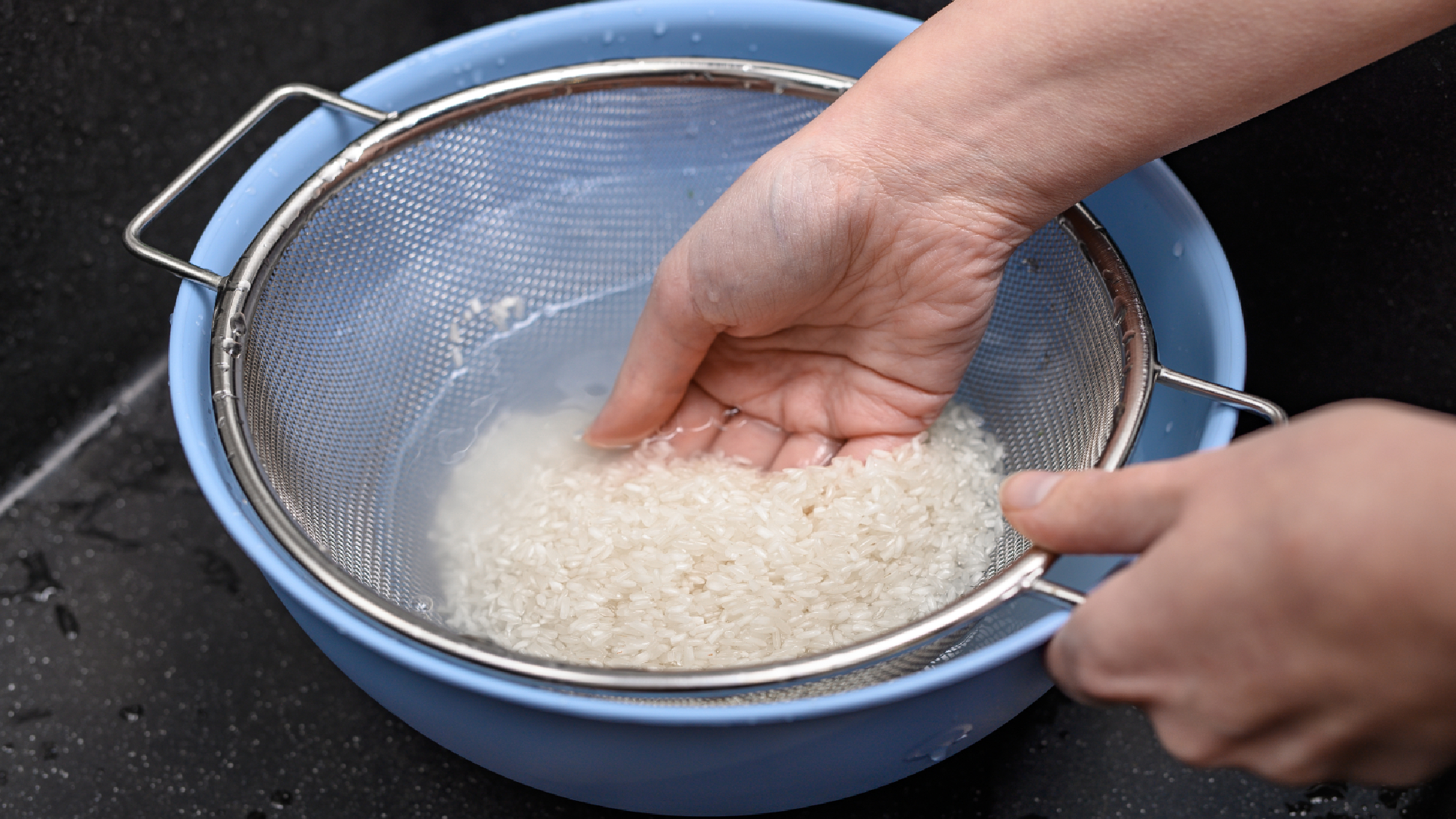 Rice water being strained
