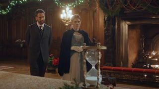 A look at the hourglass sitting by a fireplace in the 2026 sequel A Grand Biltmore Christmas.