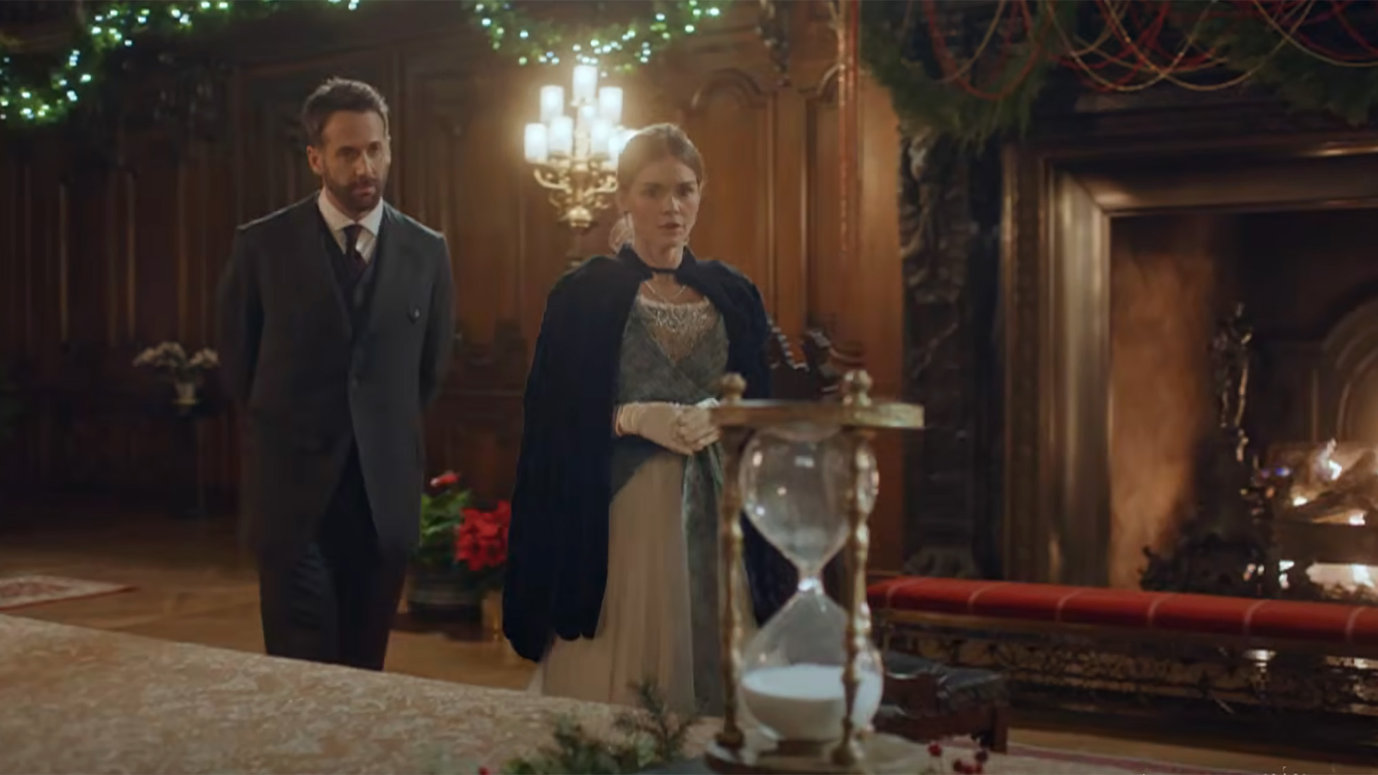 A look at the hourglass sitting by a fireplace in the 2026 sequel A Grand Biltmore Christmas.