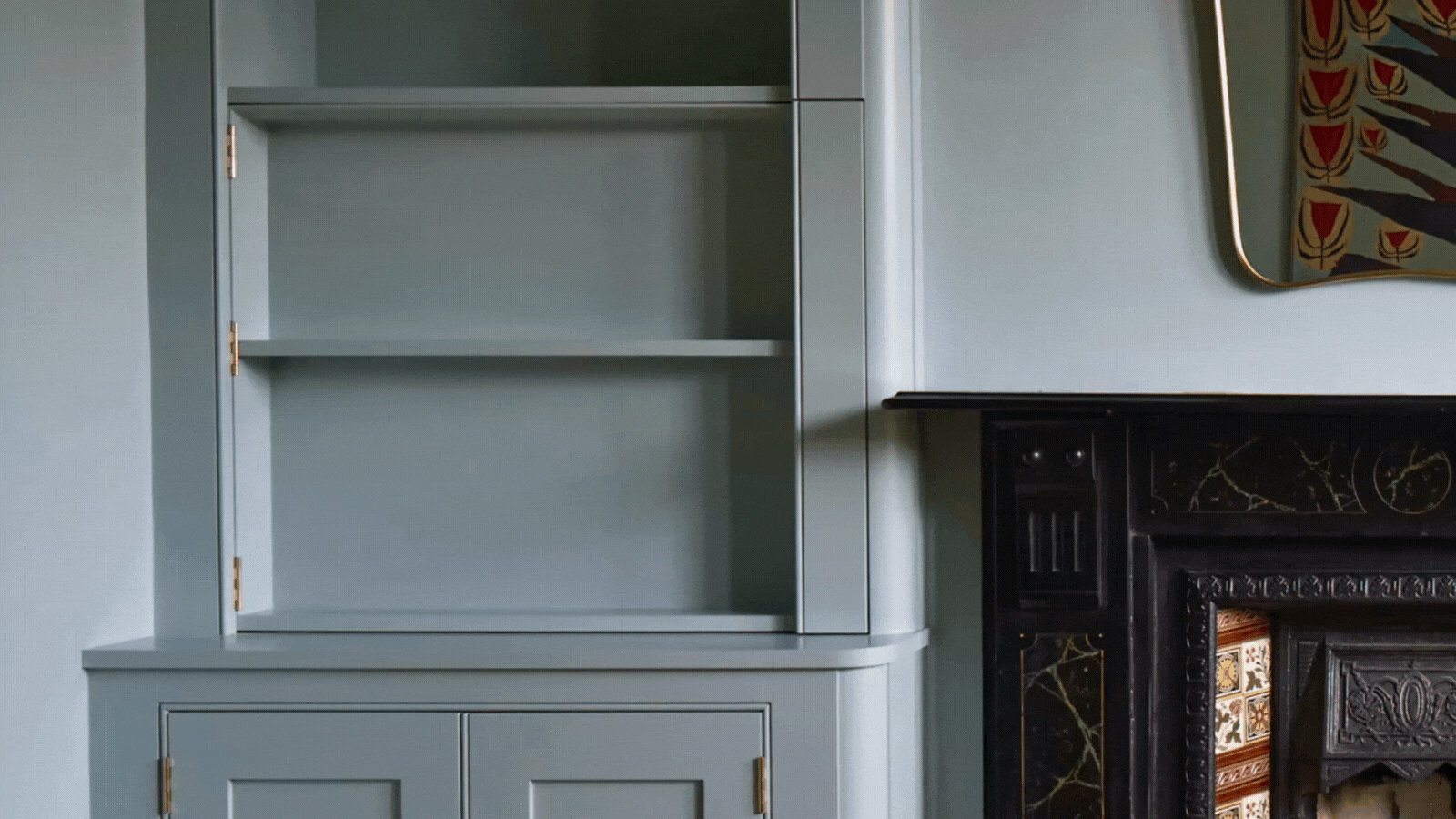 tv hidden behind a blue cabinet