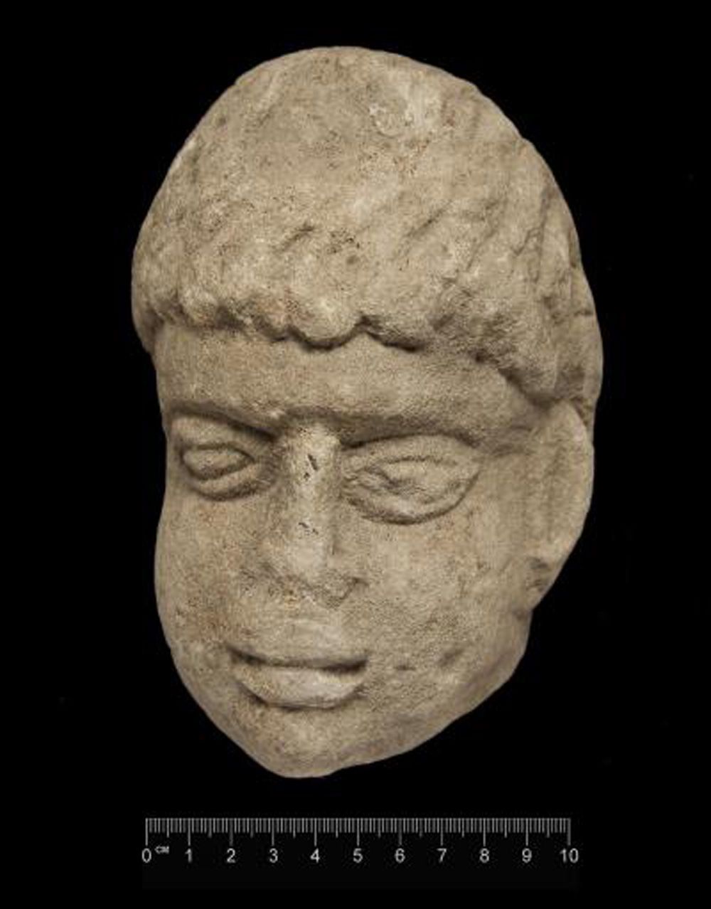 Carved stone head