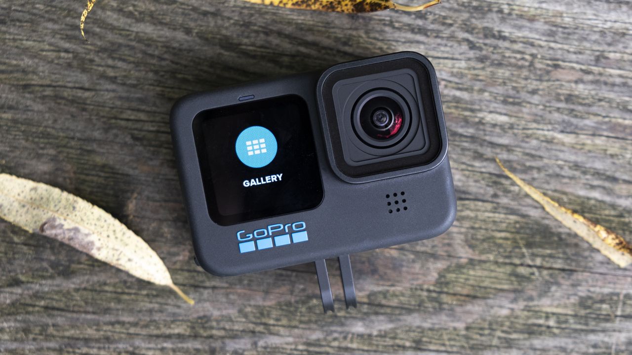 The GoPro Hero 10 Black action camera sitting on a wooden bench