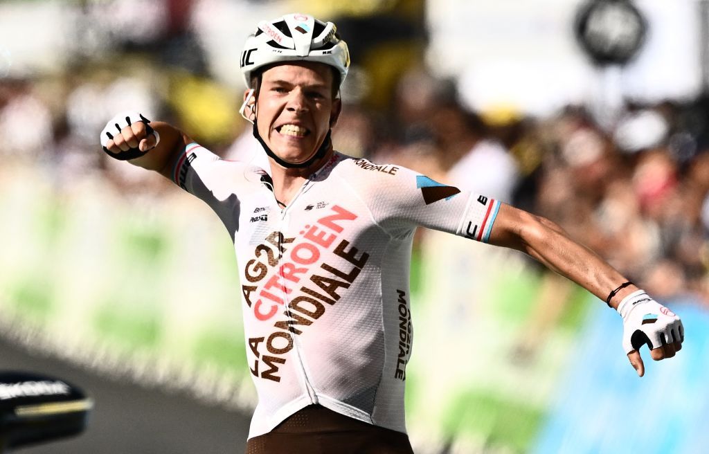 AG2R Citroen Teams Luxembourgish rider Bob Jungels celebrates as he cycles to the finish line to win the 9th stage of the 109th edition of the Tour de France cycling race 1929 km between Aigle in Switzerland and Chatel Les Portes du Soleil in the French Alps on July 10 2022 Photo by Marco BERTORELLO AFP Photo by MARCO BERTORELLOAFP via Getty Images