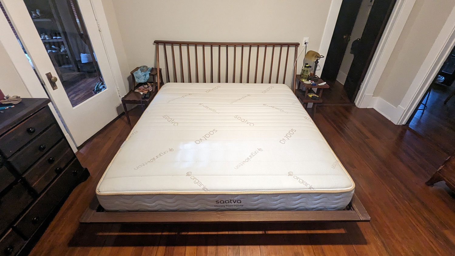 The Saatva Memory Foam Hybrid mattress on a bed in a bedroom