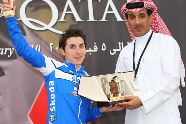 Giorgia Bronzini (Italy) is presented with the stage trophy by Ahme Alhemaidi