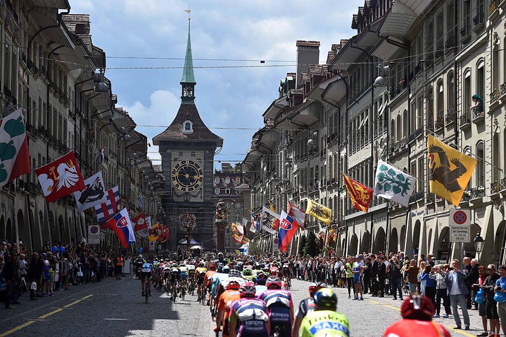Tour de Suisse stage 8 as the peloton races toward the clock tower