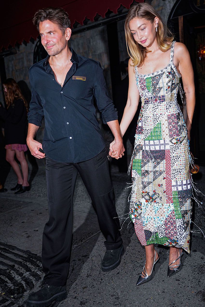 Gigi Hadid wearing a patchwork dress and silver shoes in NYC
