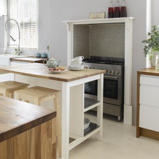 kitchen island unit with storage and wooden top