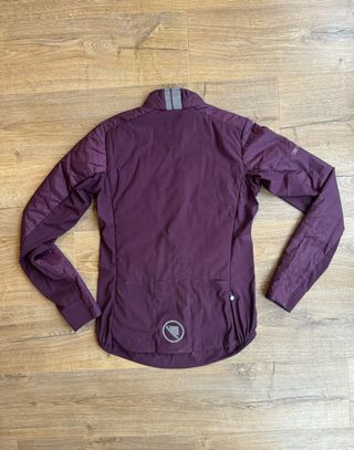 Flay lay Endura jacket in burgundy from the reverse