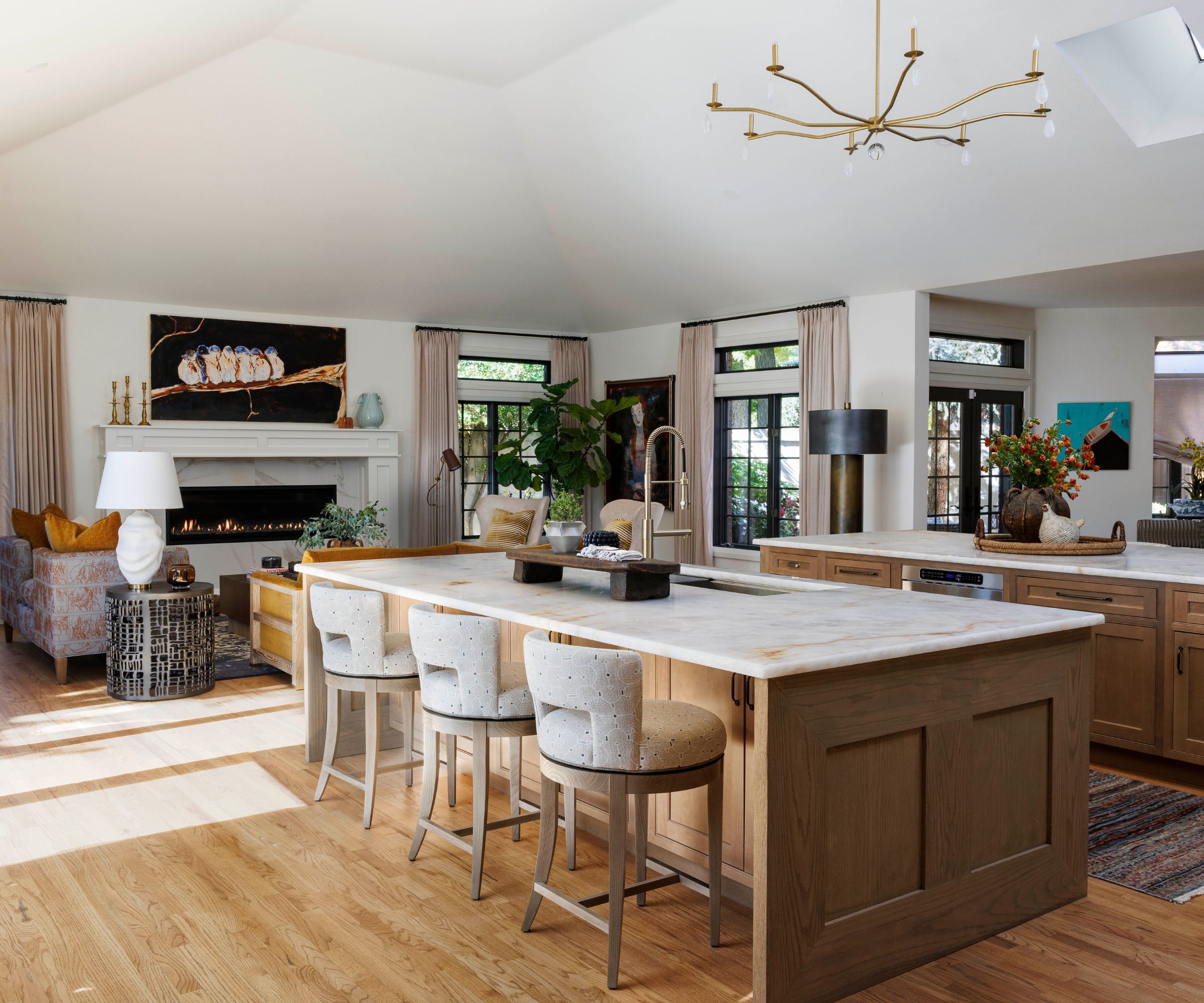 Open plan living room and kitchen with two large wooden islands