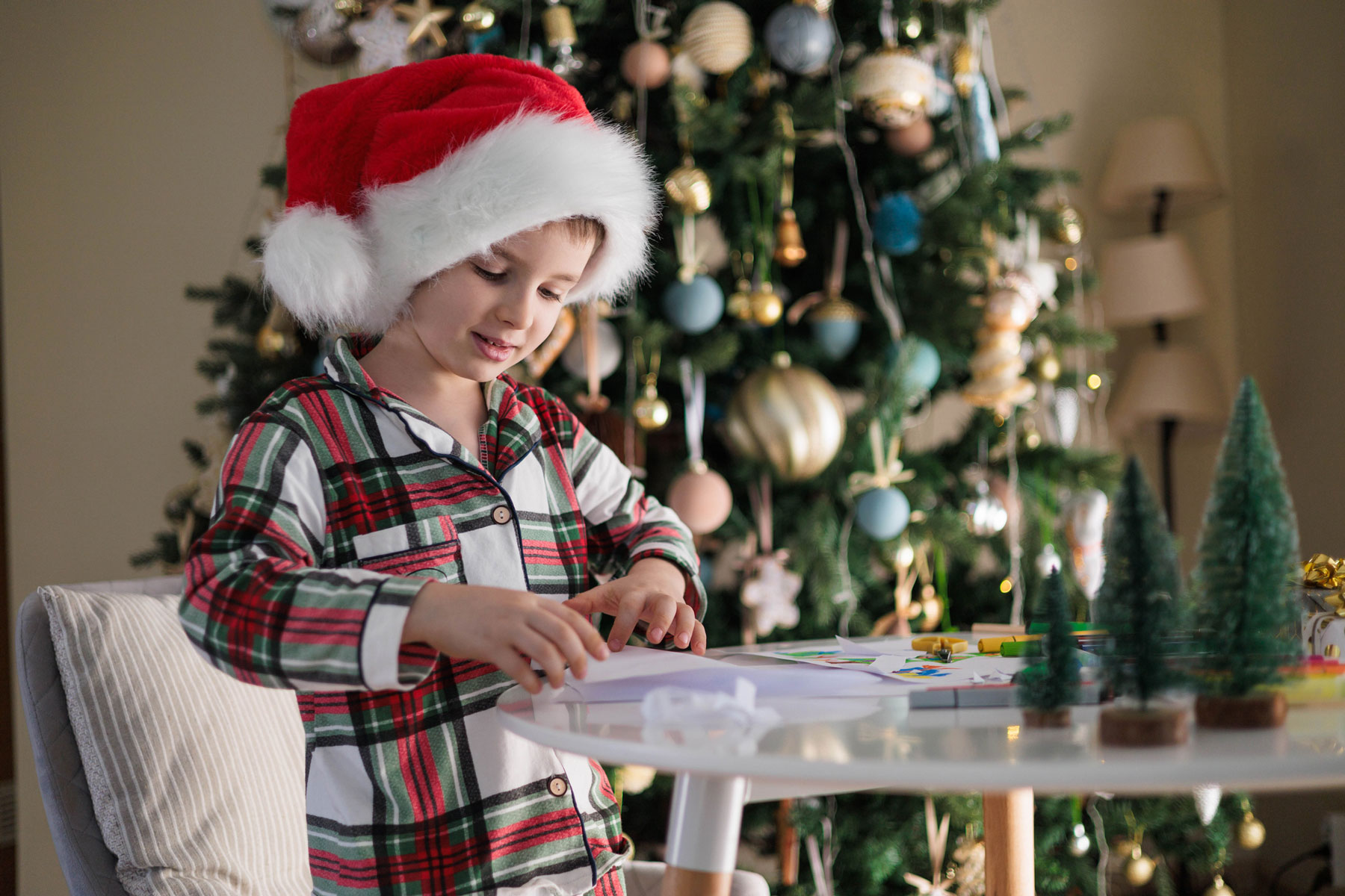 one child doing christmas drawing