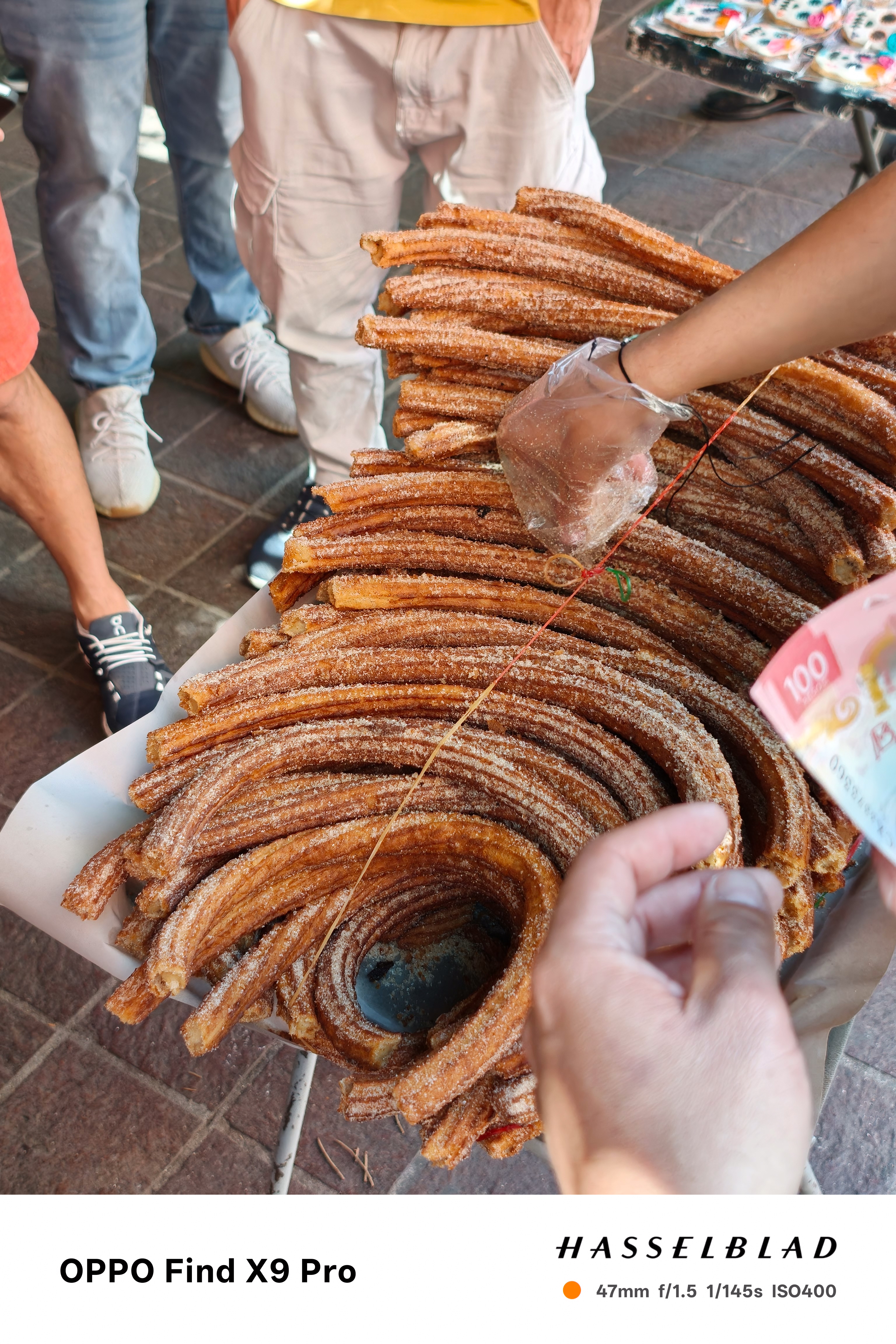 A person selling churros on the streets of Mexico City