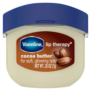 mini tub of Vaseline Lip Therapy Cocoa Butter on a white background