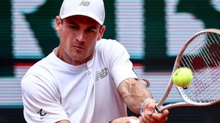 US Tommy Paul plays a backhand return to Australia's Alexei Popyrin during their men's singles match on day 8 of the French Open tennis tournament on Court Suzanne-Lenglen at the Roland-Garros Complex in Paris on June 1, 2025. (Photo by Anne-Christine POUJOULAT / AFP) (Photo by ANNE-CHRISTINE POUJOULAT/AFP via Getty Images)