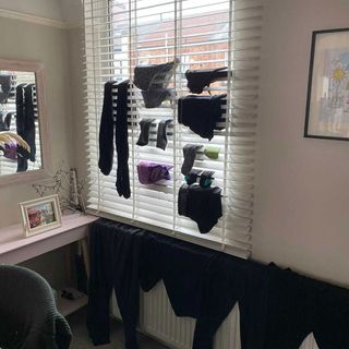 drying clothes on window blinds