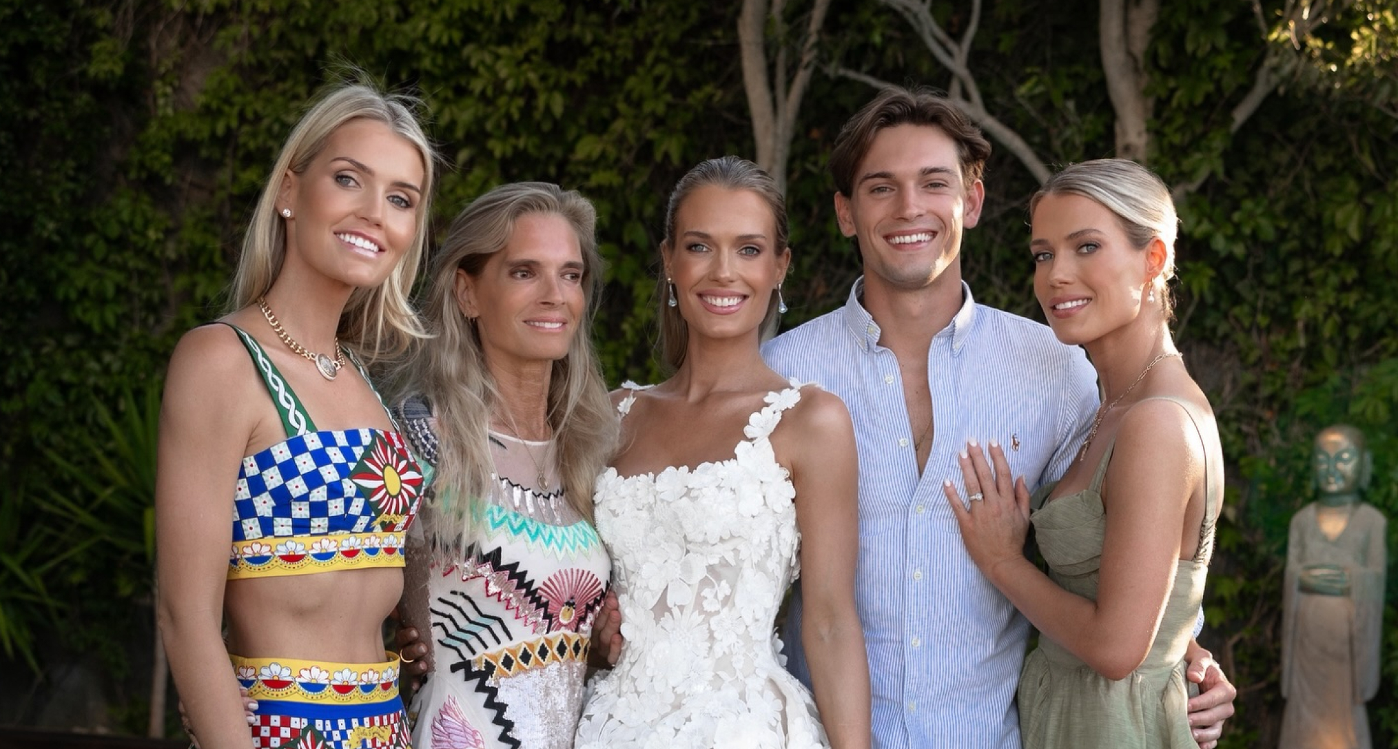 Kitty Spencer, Victoria Lockwood, Eliza Spencer, Samuel Aitken, Amelia Spencer standing in a row in front of trees