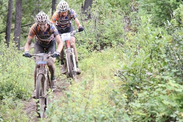 Kris Sneddon leads Barry Wicks through the mud.