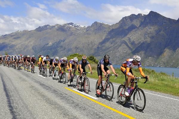 Karl Murray leads the peloton along the shore of Lake Wakatipu