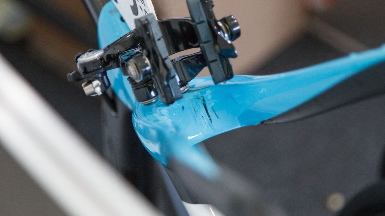 Even the bikes of pros show cosmetic damage. Here, this Team Sky Pinarello shows some scratching from grit/rocks caught in the tyre