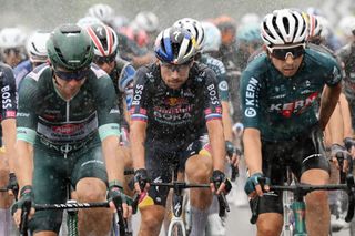 SANTANDER SPAIN SEPTEMBER 04 LR Kaden Groves of Australia and Team Alpecin Deceuninck Green Points Jersey and Primoz Roglic of Slovenia and Team Red Bull Bora hansgrohe compete under heavy rain during the La Vuelta 79th Tour of Spain 2024 Stage 17 a 1415km stage Arnuero to Santander UCIWT on September 04 2024 in Santander Spain Photo by Dario BelingheriGetty Images