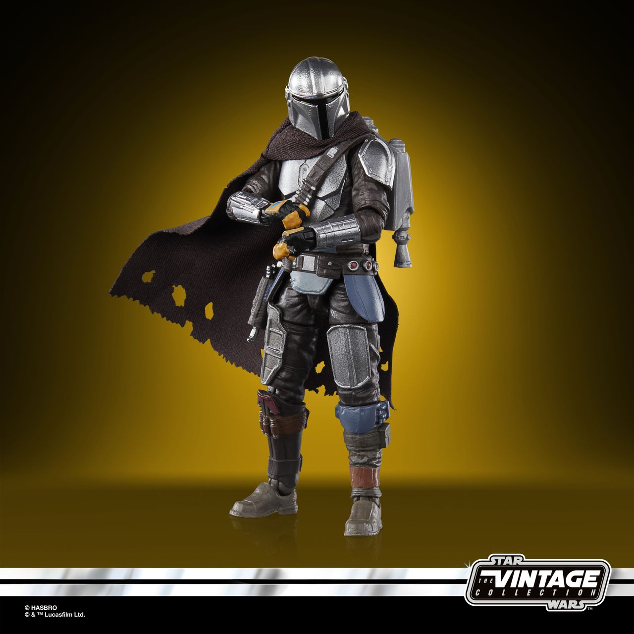 The Vintage Collection Mandalorian figure, posed on a yellow and black background