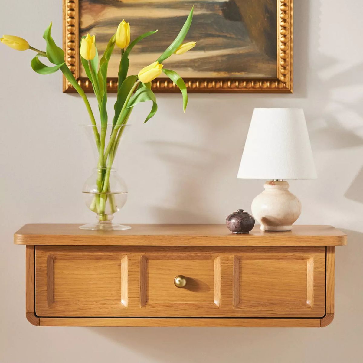 A small floating shelf with a drawer