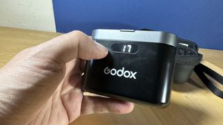 Godox WEC microphone case displaying the battery percentage