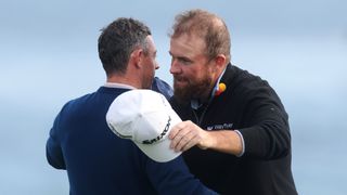 Shane Lowry congratulates Rory McIlroy after his win at the Pebble Beach Pro-Am