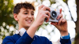 A child holds the myFirst Insta Lux camera