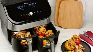 The Instant Vortex Dual Drawer with food in both frying baskets