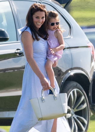 Catherine, Duchess of Cambridge and Princess Charlotte of Cambridge during the Maserati Royal Charity Polo Trophy at Beaufort Park on June 10, 2018 in Gloucester, England