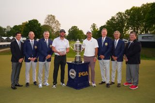 Koepka poses with members from the PGA of America