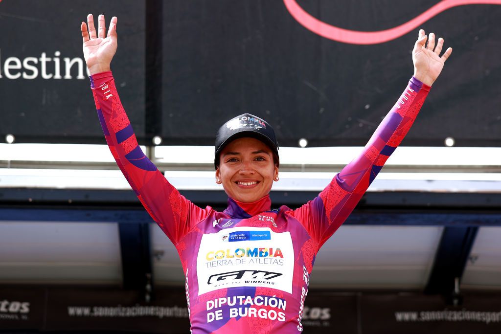 AGUILAR DE CAMPOO SPAIN MAY 20 Jennifer Tatiana Ducuara Acevedo of Colombia and Team Colombia Tierra De Atletas Gw Shimano celebrates winning the pink leader jersey on the podium ceremony after the 7th Vuelta a Burgos Feminas 2022 Stage 2 a 128km stage from Sasamn to Aguilar de Campoo VueltaBurgos BurgosFem UCIWWT on May 20 2022 in Aguilar de Campoo Spain Photo by Gonzalo Arroyo MorenoGetty Images