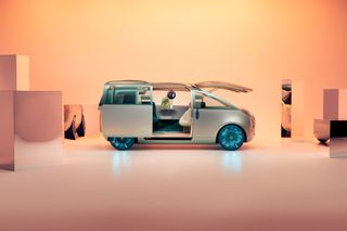 Side view of the MINI Vision Urbanaut Concept car with doors and bonnet open.
