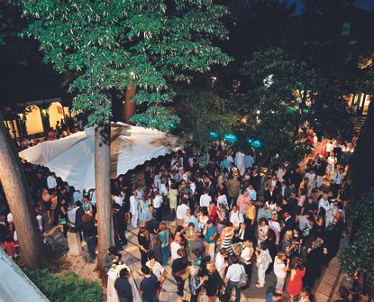 in preparation for venice architecture biennale 2023, we explore a picture of people seen from above at a peggy guggenheim foundation party in venice during the venice architecture biennale 2008