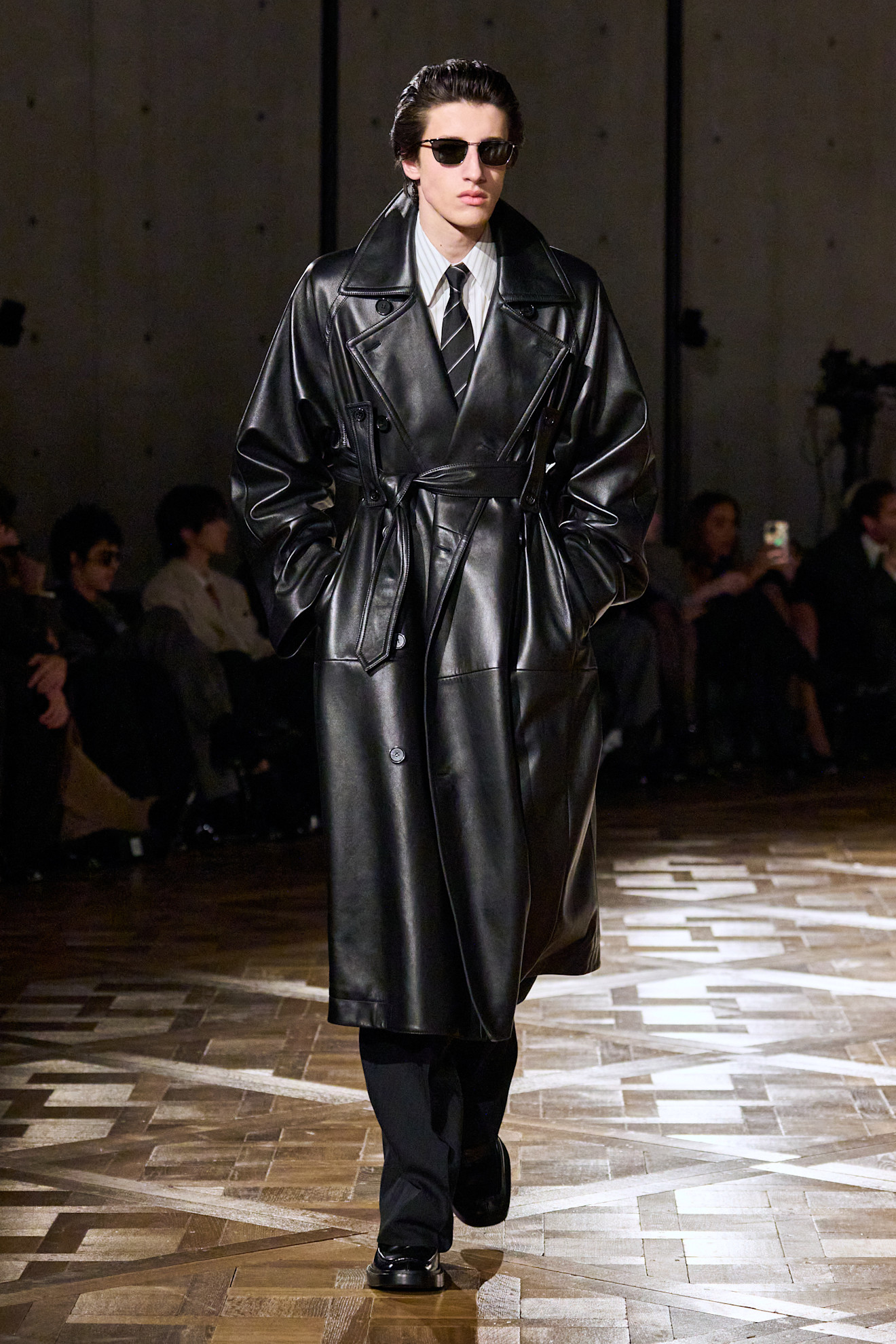 A model wore a leather trench coat during the Saint Laurent Fall 2025 Men's show