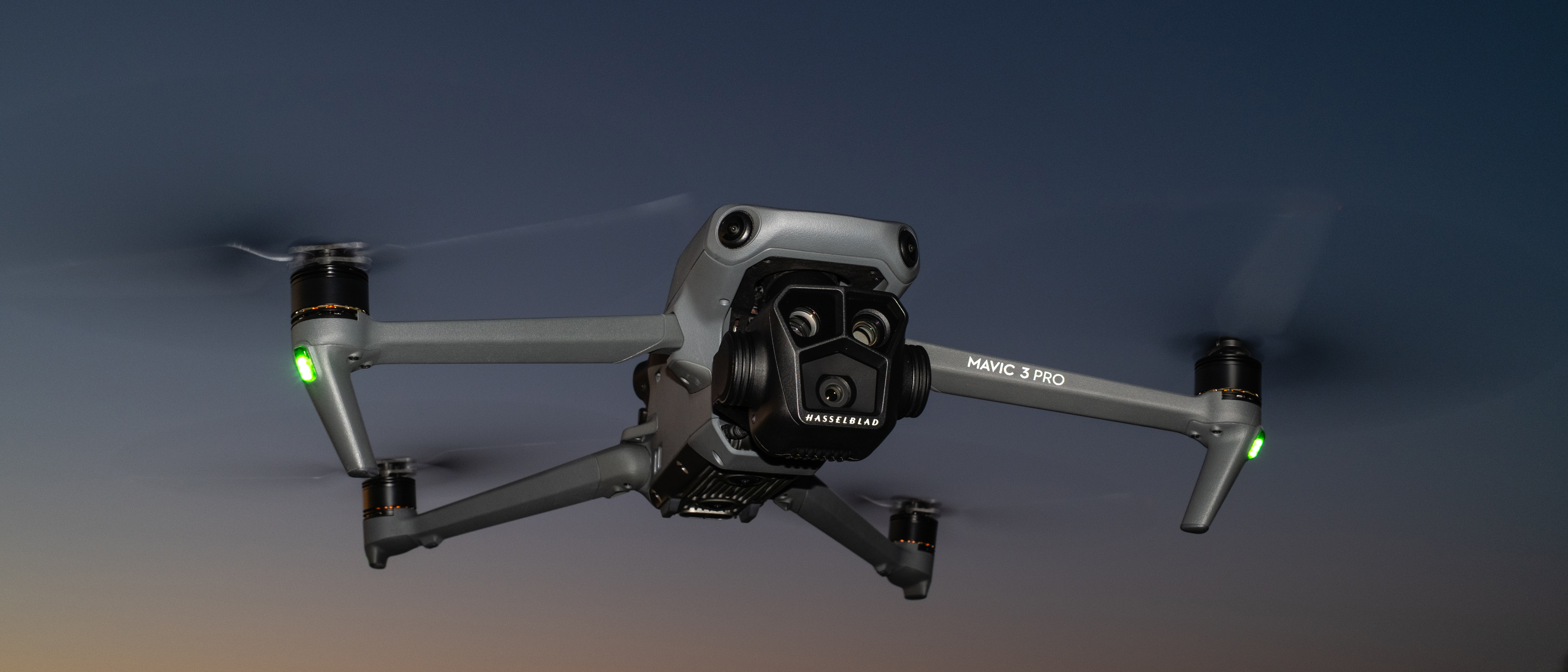 DJI Mavic 3 Pro flying at night against a clear sky
