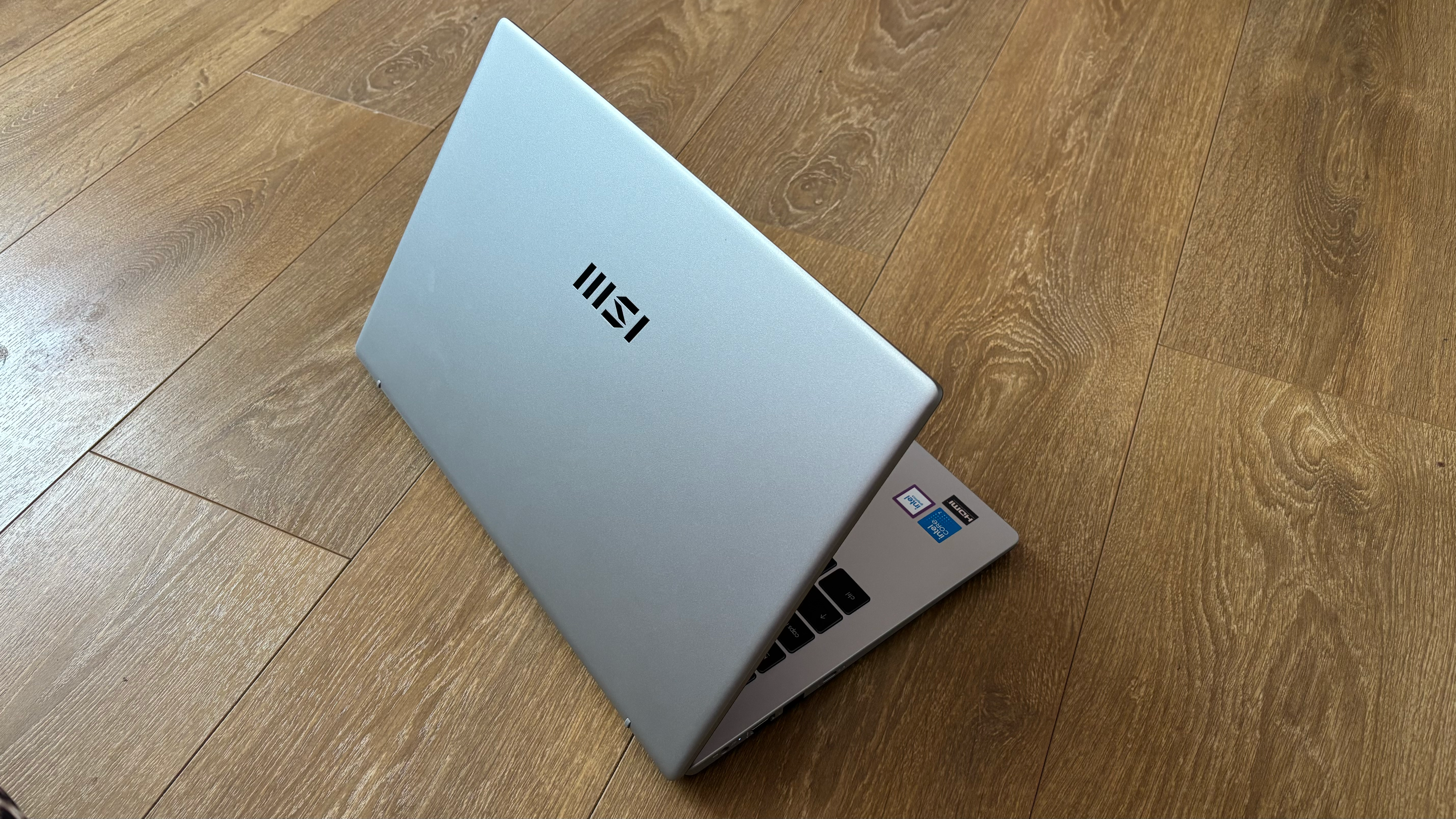 MSI Modern 15 laptop on a wooden desk