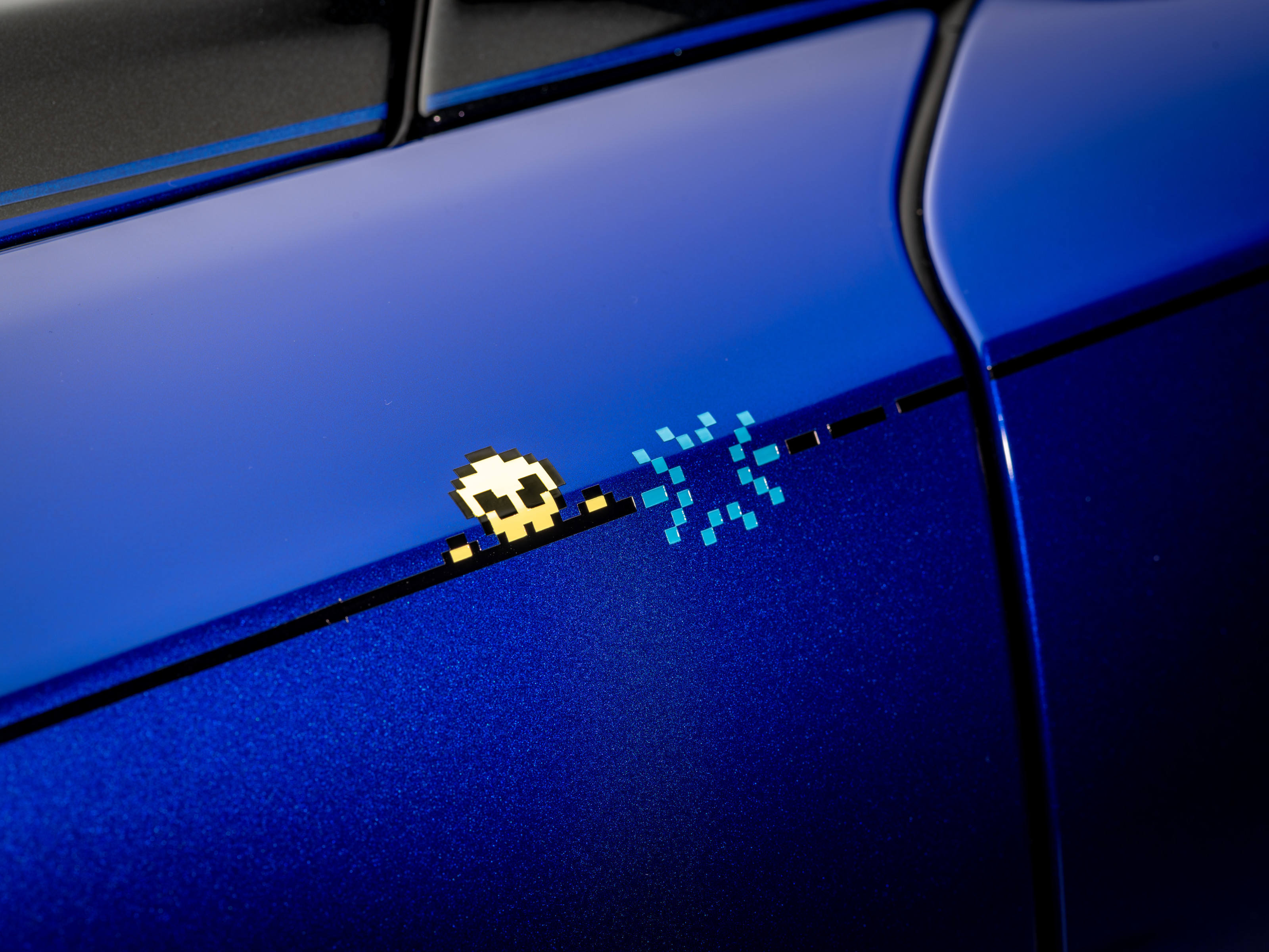 The hand-painted &#039;cheeky alien&#039; coachline motif