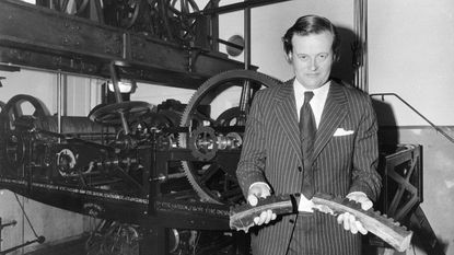 Robin Cooke, chair of administration at the House of Commons, holding broken parts of the clock © Central Press/Getty Images