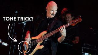 Tony Levin performs on stage with English musician Peter Gabriel (unseen) during a concert at the Accor Arena in Paris, on May 23, 2023.