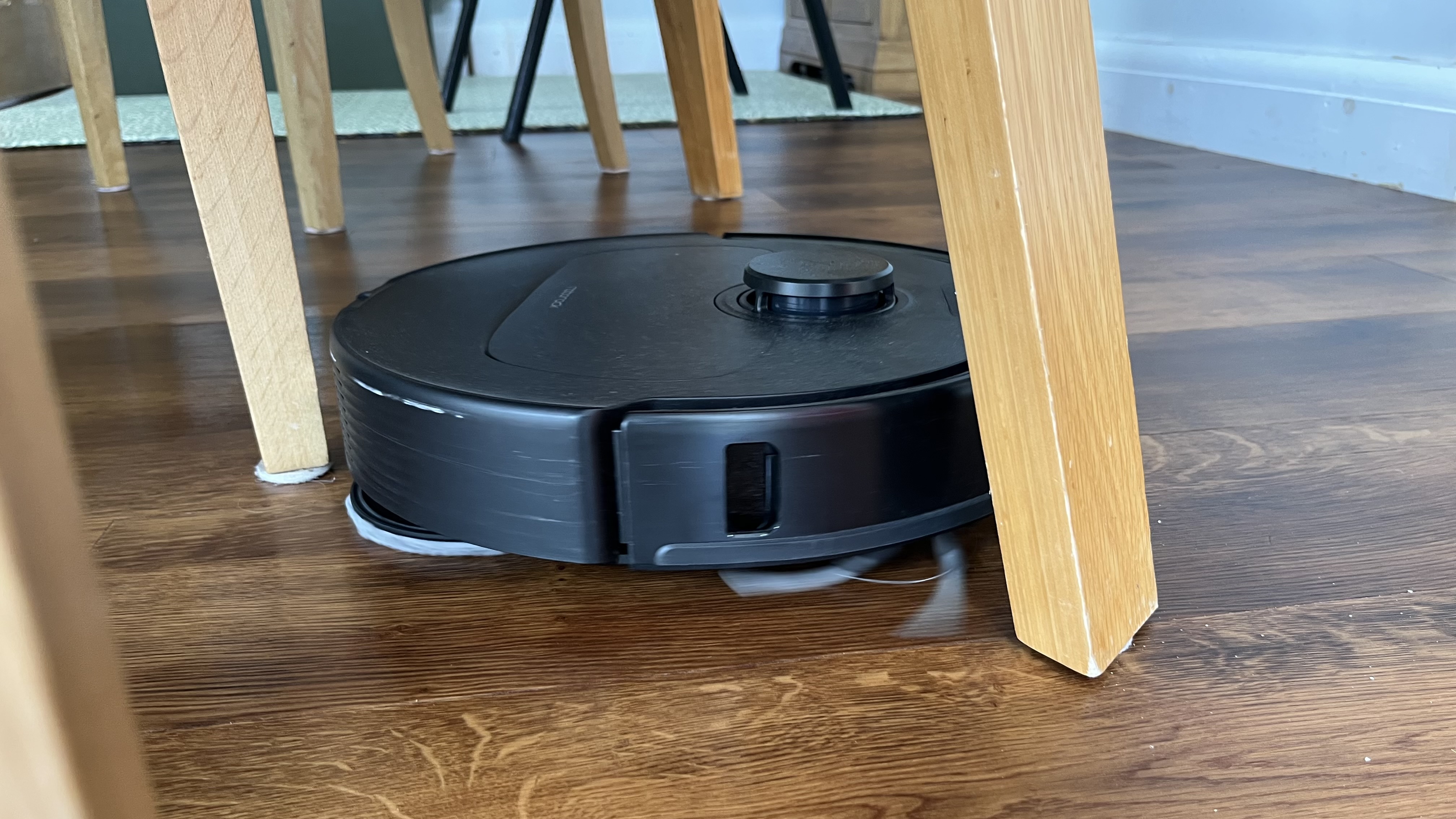 roborock Qrevo S Pro maneuvering around furniture