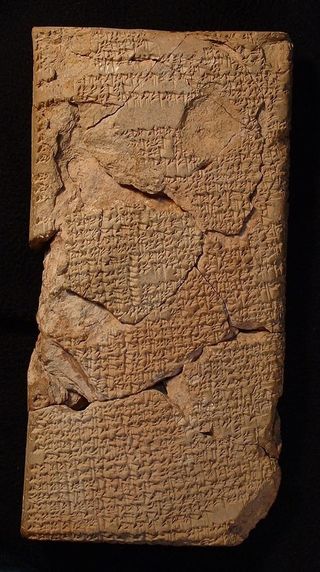 A long, rectangular tablet with cuneiform writing