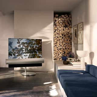 room with cream wall and music system in oled tv