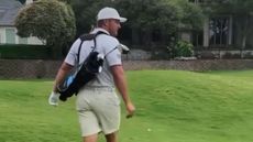 Bryson DeChambeau plays a hole with junior golf clubs
